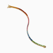 The Watercolors 14K Yellow Gold Multi Sapphire Oval Tennis Bracelet features a gradient rainbow of oval sapphires, smoothly transitioning in color from red and orange to yellow, green, blue, and purple.