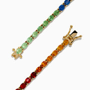 The Watercolors 14K Yellow Gold Multi Sapphire Oval Tennis Bracelet features a gradient rainbow of oval sapphires, smoothly transitioning in color from red and orange to yellow, green, blue, and purple.