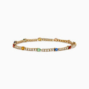 The Watercolors 14K Yellow Gold Multi Sapphire and Diamond Tennis Bracelet features a delicate band with alternating white diamonds and green, blue, red, yellow, and orange sapphires in a symmetrical design.