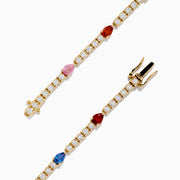 The Watercolors 14K Yellow Gold Multi Sapphire and Diamond Tennis Bracelet features a delicate band with alternating white diamonds and green, blue, red, yellow, and orange sapphires in a symmetrical design.