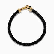 The Men's 14K Yellow Gold Diamond Accented Horseshoe Leather Bracelet features black braided leather and a gold, diamond-accented horseshoe clasp, shown against a plain white background.