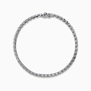 The 14K White Gold Diamond Miracle Setting 1.00ct Tennis Bracelet features a continuous row of round, sparkling white diamonds set in a slim, polished 14K white gold band and is displayed on a white background.
