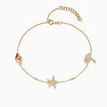 Delicate Novelty 14K Yellow Gold Diamond Seaside Ankle Bracelet features a shell, a starfish with small stones, and a palm tree charm, displayed on a white background. A charming piece from Effy Novelty.