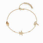 Delicate Novelty 14K Yellow Gold Diamond Seaside Ankle Bracelet features a shell, a starfish with small stones, and a palm tree charm, displayed on a white background. A charming piece from Effy Novelty.