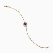 Elegant 14K yellow gold bracelet featuring a purple enamel evil eye charm accented with black and white diamonds—an eye-catching novelty piece perfect for everyday protection.