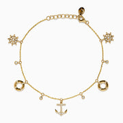 The 14K Yellow Gold Diamond Nautical Charm Bracelet features ship wheels, life rings, sparkling crystals, and a stone-adorned anchor. It includes an adjustable chain and lobster clasp for a perfect fit.
