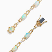 The Aurora 14K Yellow Gold Opal and Diamond Bracelet features evenly spaced round opals in individual links, accented with diamonds for a refined and elegant accessory.