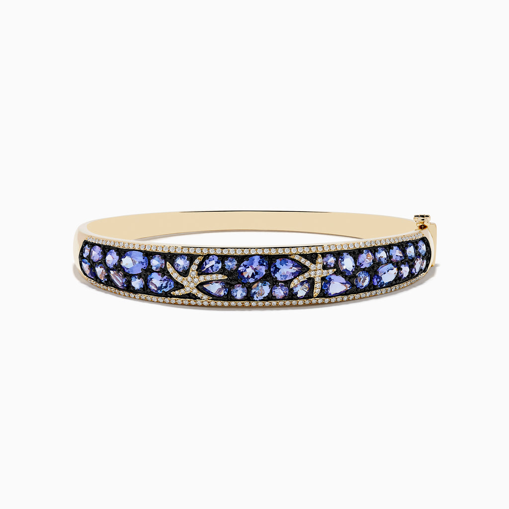 A 14K yellow gold bangle bracelet featuring tanzanite and diamond accents in a starfish design.