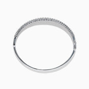 The Classique 14K White Gold Diamond Bangle features two rows of round diamonds and a central row of baguette-cut diamonds, elegantly set against a plain white background.