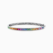 The Watercolors 14K White Gold Multi Sapphire Bangle features a row of square-cut sapphires in a rainbow gradient, set in sleek white gold with a clasp closure.