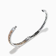 The 14K Two-Tone Gold Pink and White Diamond Bangle features an open cuff with a detailed lattice design and gemstone accents. Shown against a white background, one end appears threaded, indicating it can be screwed closed.