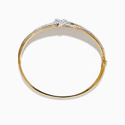 The Duo 14K White and Yellow Gold Diamond Bangle features a central knot design set with sparkling diamonds and bordered by diamond accents along the edges.
