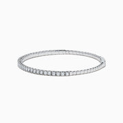 The Pave Classica 14K White Gold Diamond Bangle 1.45 TCW features a slim white gold design with a continuous row of sparkling diamonds, elegantly displayed against a plain white background.
