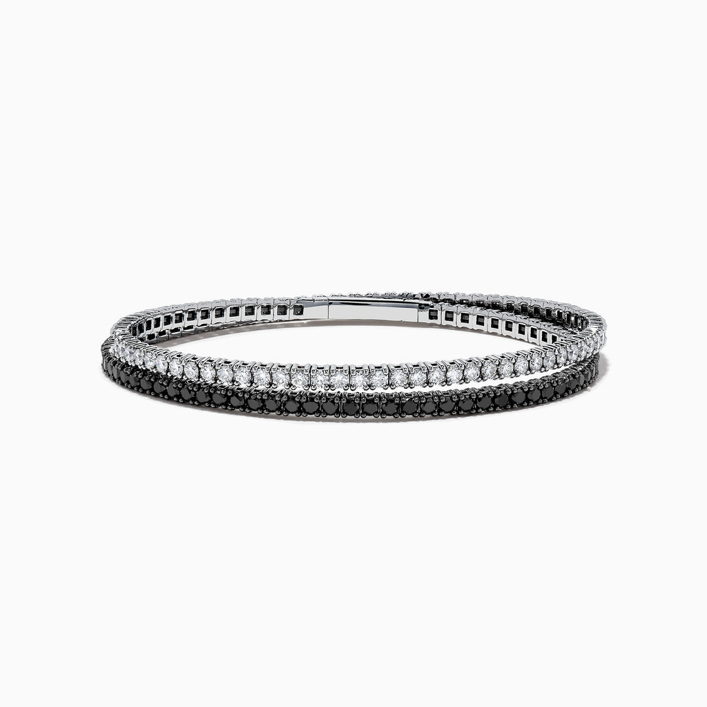 The 14k White Gold Black and White Diamond Double Wrap Bracelet 6.77 TCW features two rows: one with sparkling white diamonds and the other with striking black diamonds, creating a bold yet elegant contrast.