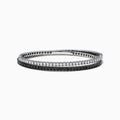 The 14k White Gold Black and White Diamond Double Wrap Bracelet 6.77 TCW features two rows: one with sparkling white diamonds and the other with striking black diamonds, creating a bold yet elegant contrast.