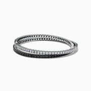 The 14k White Gold Black and White Diamond Double Wrap Bracelet 6.77 TCW features two rows: one with sparkling white diamonds and the other with striking black diamonds, creating a bold yet elegant contrast.