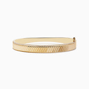 Mens 14K yellow gold diamond bangle, 0.51 TCW, features a ridged diagonal pattern and a delicate row of small diamonds along the top edge, shown on a white background.