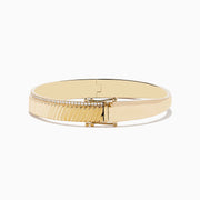 Mens 14K yellow gold diamond bangle, 0.51 TCW, features a ridged diagonal pattern and a delicate row of small diamonds along the top edge, shown on a white background.