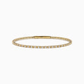 The 14K Yellow Gold Diamond Flex Bangle features a single row of sparkling white diamonds and a secure clasp, presented against a white background.