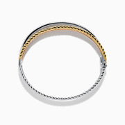 The Trio 14K Tri-Color Gold Crossover Diamond Bangle showcases intertwined strands of silver, gold, and rose gold tones, with one strand sparkling with diamond accents for a stylish look.