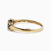 The Signature 14K Yellow Gold Diamond and Emerald Panther Bangle features two emerald-eyed panther heads facing each other, joined by a gold ring set with sparkling diamonds.