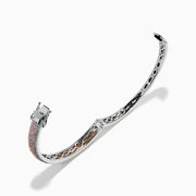 The 14K Two Tone Gold Pink and White Diamond Bangle features an intricate cutout design, accented by a central band with sparkling pink and white diamonds.