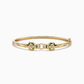 The Signature 14K Gold Diamond and Tsavorite Double Panther Head Bangle features two intertwined bands with geometric black and green enamel, diamond accents, and a panther motif, shown on a white background.