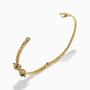 Introducing the Signature 14K Yellow Gold Diamond Chain-Link Panther Bangle Bracelet—a bold reinterpretation of the classic diamond bangle. This striking piece showcases an elegant chain-link design in 14K yellow gold, featuring two intricately sculpted panther heads adorned with green and clear gemstones, joined at the center by a sparkling, circular, gem-encrusted link.