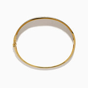 The DOro 14K Yellow Gold Diamond Bangle showcases a textured vertical striped design with sparkling diamonds bordering the top and bottom edges.