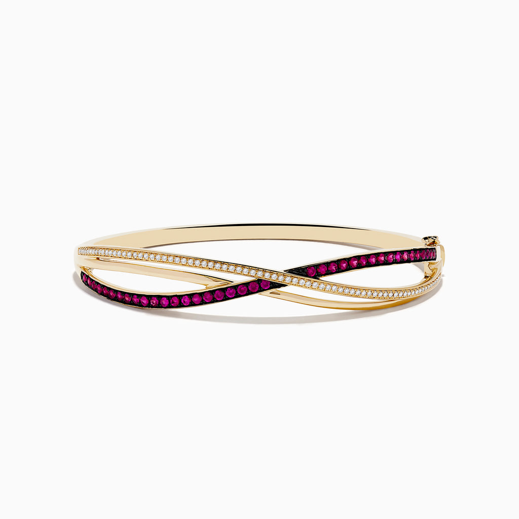 The Ruby Royale 14K Yellow Gold Ruby and Diamond Crossover Bangle features sparkling diamonds and vibrant rubies in a striking crisscross design.