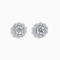 The Star Lab Grown Diamond Fleur Stud Earrings feature a central round diamond with a floral halo of smaller diamonds, beautifully set in 18K white gold for a timeless look.