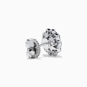 The Star Lab Grown Diamond Fleur Stud Earrings feature a central round diamond with a floral halo of smaller diamonds, beautifully set in 18K white gold for a timeless look.