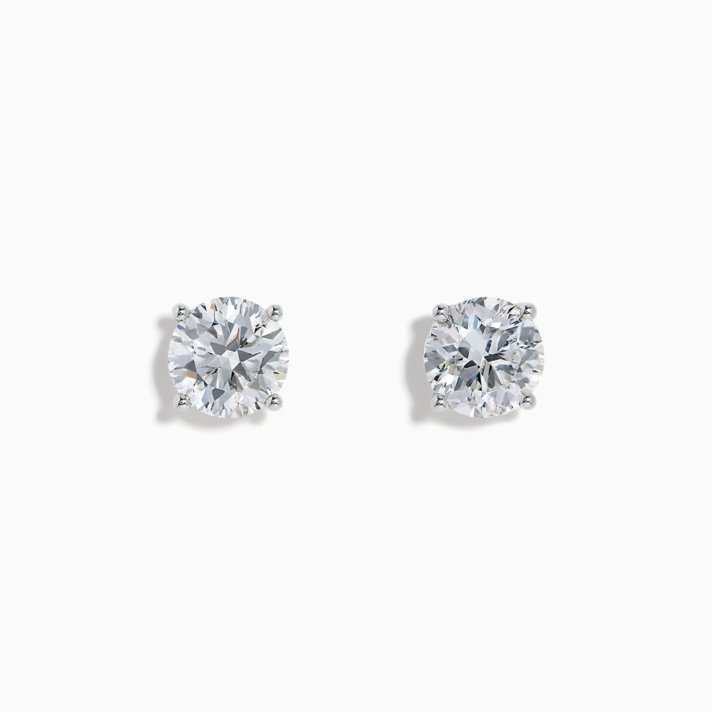 The Star Lab Grown Diamond Stud Earrings feature round, clear lab diamonds set in elegant four-prong 18K white gold settings, shown on a white background.