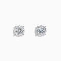 The Star Lab Grown Diamond Stud Earrings feature round, clear lab diamonds set in elegant four-prong 18K white gold settings, shown on a white background.