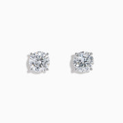 The Star Lab Grown Diamond Stud Earrings feature round, clear lab diamonds set in elegant four-prong 18K white gold settings, shown on a white background.