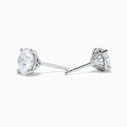 The Star Lab Grown Diamond Stud Earrings feature round, clear lab diamonds set in elegant four-prong 18K white gold settings, shown on a white background.