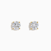 The Star Lab Grown Diamond Stud Earrings in 18K yellow gold feature round, clear lab diamonds in prong settings, shown against a white background.