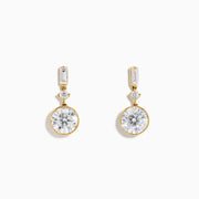 Star Lab Grown Diamond Bezel Solitaire Drop Earrings in 18K yellow gold feature large round center stones, a smaller round stone above each, and a rectangular top stone, all set against a plain white background.