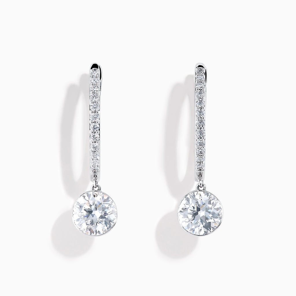 Star Lab Grown Diamond Pave Hoop Solitaire Earrings in 18K White Gold, featuring pavé-set diamonds along the hoop and a large round solitaire gem at the end, displayed on a white background.