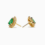The 14K Yellow Gold Pear Emerald and Diamond Halo Stud Earrings showcase teardrop green emeralds encircled by sparkling diamonds in a floral design.