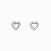 The 18K White Gold Diamond Heart Stud Earrings feature open-centered hearts outlined with sparkling diamonds, shown against a white background.