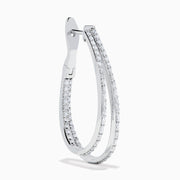 The 14K White Gold Diamond Double Hoop Earrings feature rows of sparkling diamonds on elegant double hoops, shown against a white background.