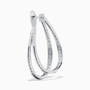 The 14K White Gold Diamond Double Hoop Earrings feature rows of sparkling diamonds on elegant double hoops, shown against a white background.