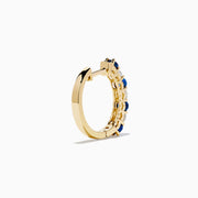 The 14K Yellow Gold Blue Sapphire & Diamond Hoop Earrings, 1.10 TCW, feature alternating sapphires and diamonds in a classic hoop design, shown on a plain white background with visible shadows.
