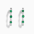 The 14K White Gold Emerald and Diamond Hoops showcase alternating round emeralds and diamonds in silver hoops, displayed against a white background.