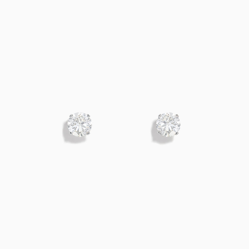 A pair of 14K White Gold Diamond Solitaire Stud Earrings, 0.75 TCW, featuring round sparkling diamonds in a classic prong setting against a plain white background.