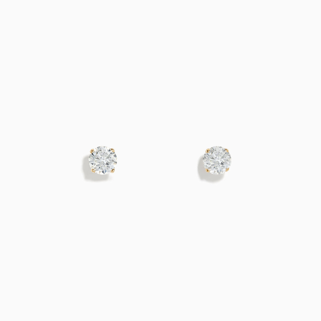 A pair of 14K Yellow Gold Diamond Solitaire Stud Earrings (0.75 TCW) are displayed against a white background.