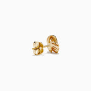The 14K Yellow Gold Diamond Love Knot Earrings feature a delicate knot design accented with sparkling diamonds, shown against a plain white background.