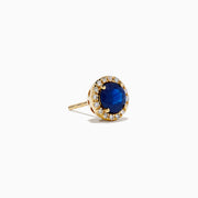 The 14K Yellow Gold Sapphire and Diamond Halo Stud Earrings feature deep blue sapphires at the center, each encircled by sparkling diamonds and displayed on a white background.