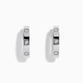 The 925 Sterling Silver Diamond Huggie Earrings feature three round diamonds set evenly along each polished hoop, shown against a white background.